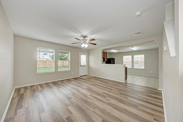 3417 Tralagon Trl, Pflugerville, TX 78660 - unfurnished living room featuring light wood-style flooring and ceiling fan