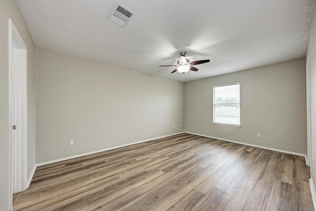 3417 Tralagon Trl, Pflugerville, TX 78660 - empty room with a ceiling fan and wood finished floors