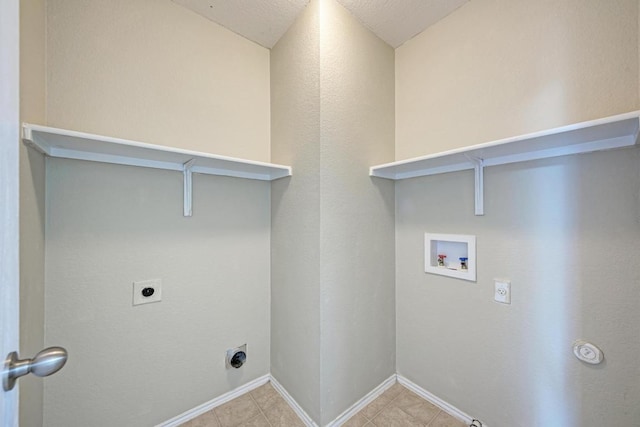 3417 Tralagon Trl, Pflugerville, TX 78660 - laundry area featuring hookup for an electric dryer, hookup for a washing machine, and light tile patterned flooring