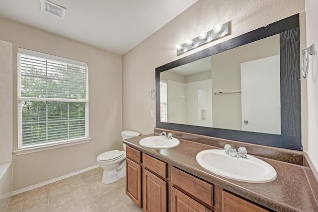 3417 Tralagon Trl, Pflugerville, TX 78660 - full bath featuring double vanity, a shower, and tile patterned flooring