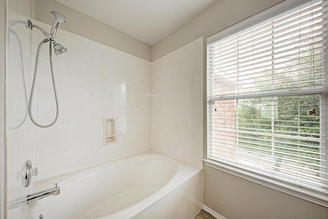 3417 Tralagon Trl, Pflugerville, TX 78660 - bathroom with plenty of natural light and shower / tub combination
