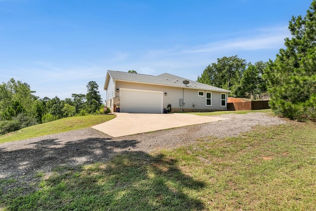 102 Moku Ct, Bastrop, TX 78602 - view of property exterior with driveway and an attached garage