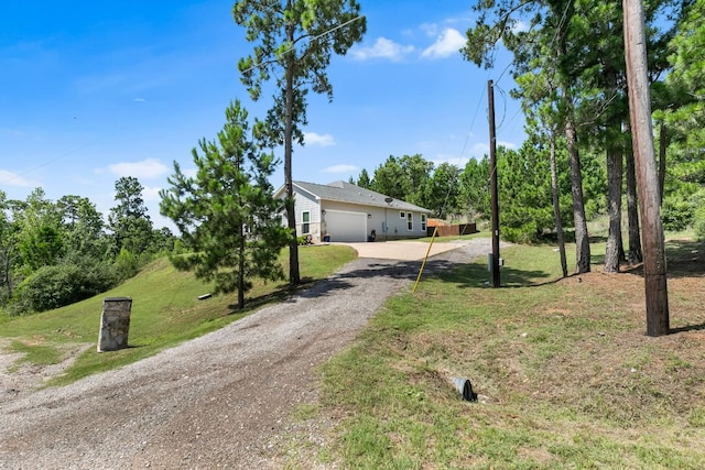102 Moku Ct, Bastrop, TX 78602 - view of front facade with driveway, an attached garage, and a front yard