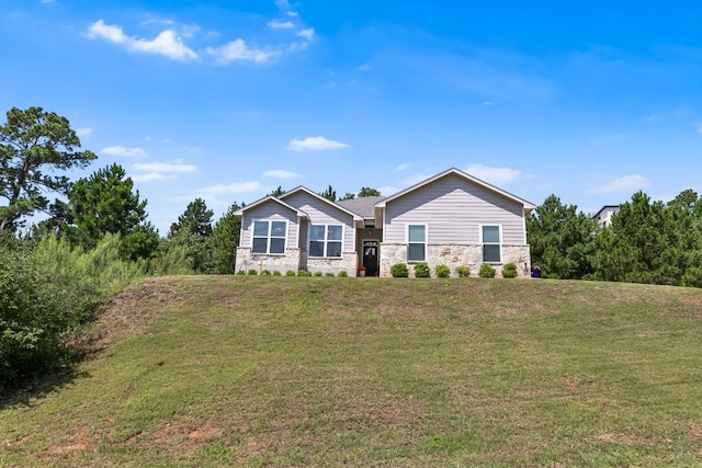 102 Moku Ct, Bastrop, TX 78602 - single story home featuring stone siding and a front lawn