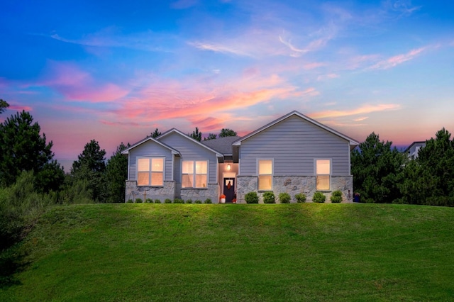 102 Moku Ct, Bastrop, TX 78602 - contemporary home with stone siding and a lawn
