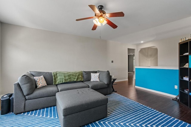 2611 Terlingua Dr, Cedar Park, TX 78613 - living room featuring wood finished floors, a ceiling fan, and arched walkways