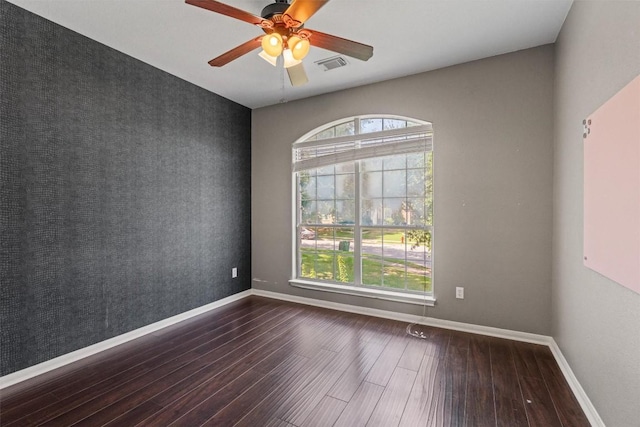 2611 Terlingua Dr, Cedar Park, TX 78613 - spare room with an accent wall, wood finished floors, and ceiling fan