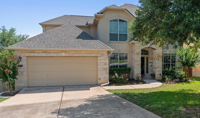2611 Terlingua Dr, Cedar Park, TX 78613 - view of front of house with roof with shingles, driveway, stone siding, an attached garage, and stucco siding