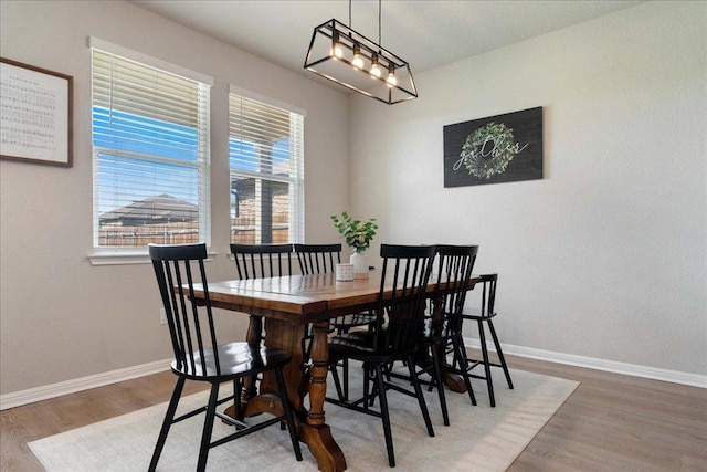 200 Mais Dr, Georgetown, TX 78626 - dining space with baseboards and wood finished floors