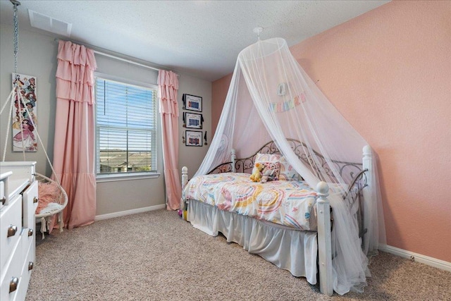 200 Mais Dr, Georgetown, TX 78626 - carpeted bedroom featuring baseboards and a textured ceiling