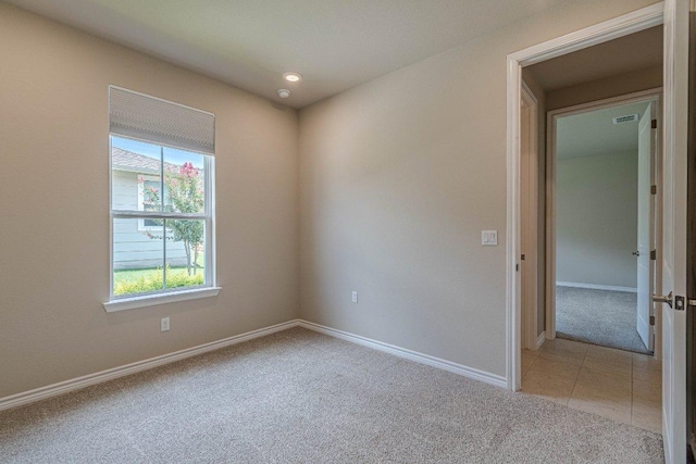 116 Mulligan Dr Unit 103, San Marcos, TX 78666 - spare room with light colored carpet and baseboards
