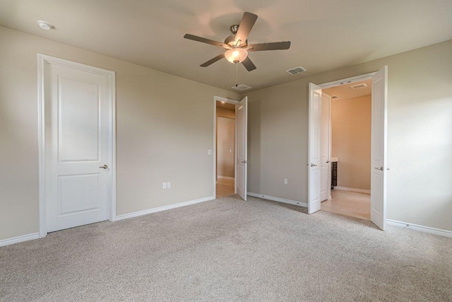 116 Mulligan Dr Unit 103, San Marcos, TX 78666 - unfurnished bedroom with light carpet and a ceiling fan