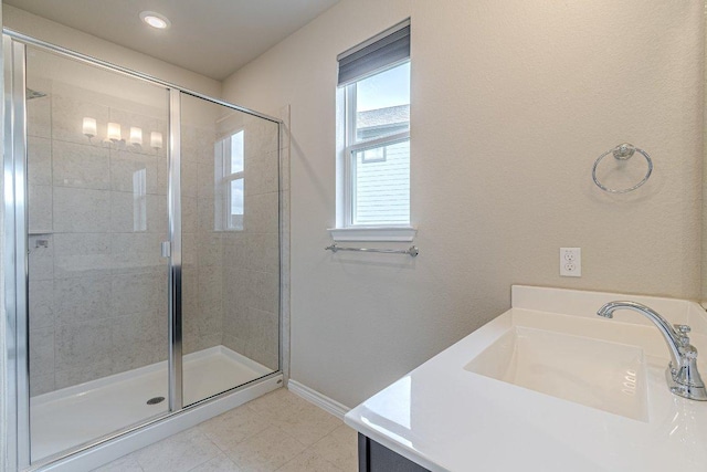 116 Mulligan Dr Unit 103, San Marcos, TX 78666 - full bathroom with a stall shower, vanity, tile patterned floors, and recessed lighting