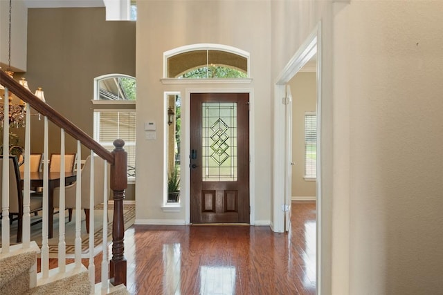 25 Falling Oaks Trl, The Hills, TX 78738 - foyer featuring wood finished floors, stairway, and a towering ceiling