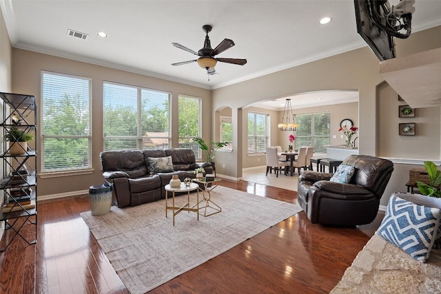 25 Falling Oaks Trl, The Hills, TX 78738 - living area featuring arched walkways, wood finished floors, crown molding, ceiling fan, and recessed lighting