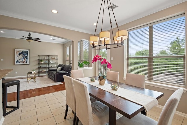 25 Falling Oaks Trl, The Hills, TX 78738 - dining area featuring plenty of natural light, a chandelier, light tile patterned flooring, ornamental molding, and recessed lighting