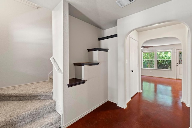 4608 Acers Ln, Austin, TX 78725 - stairs with finished concrete flooring and arched walkways