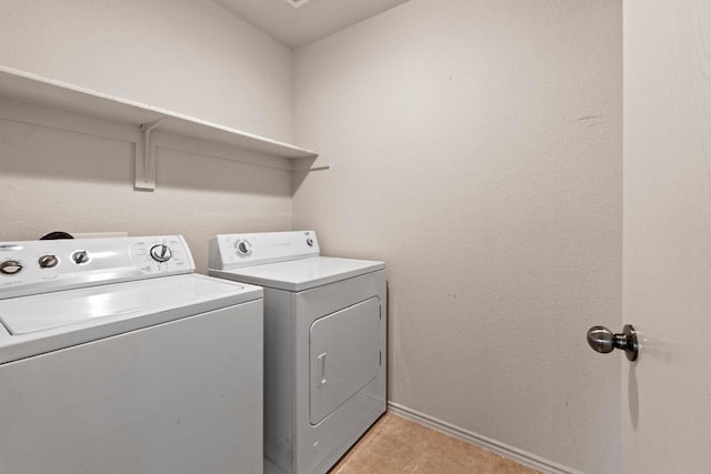 4608 Acers Ln, Austin, TX 78725 - laundry room with separate washer and dryer and baseboards