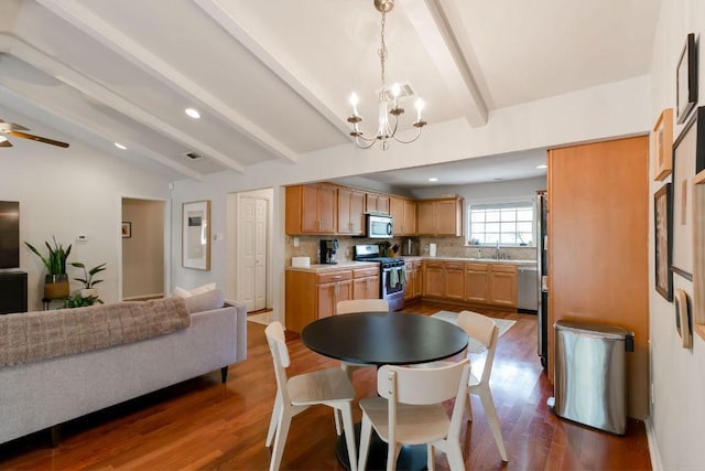 6612 Ashland Dr, Austin, TX 78723 - dining area featuring a chandelier, dark wood-style floors, recessed lighting, and ceiling fan