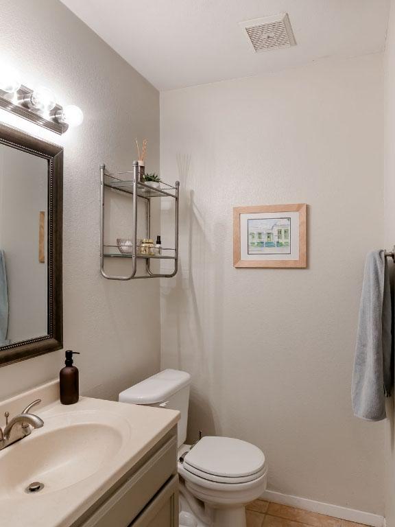 6612 Ashland Dr, Austin, TX 78723 - half bath with vanity and tile patterned flooring