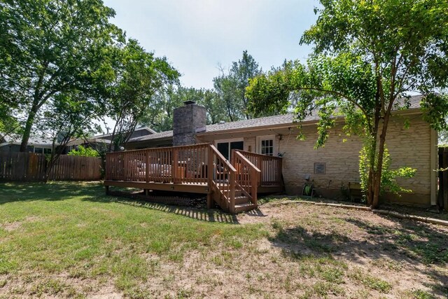 6612 Ashland Dr, Austin, TX 78723 - back of house featuring a deck and a chimney