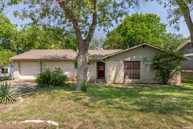 6612 Ashland Dr, Austin, TX 78723 - single story home with an attached garage, driveway, a front lawn, and stone siding