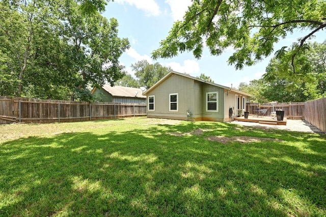 9710 Curlew Dr, Austin, TX 78748 - back of property featuring a fenced backyard and a wooden deck