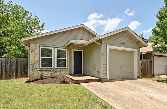 9710 Curlew Dr, Austin, TX 78748 - single story home featuring a garage, driveway, and stone siding
