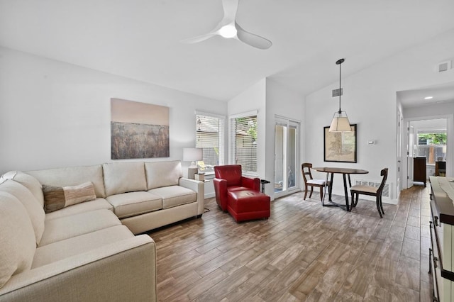 9710 Curlew Dr, Austin, TX 78748 - living room with wood finished floors, a ceiling fan, and high vaulted ceiling
