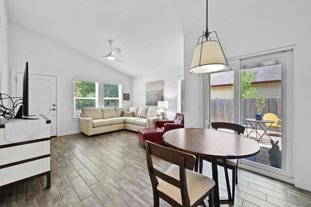 9710 Curlew Dr, Austin, TX 78748 - dining space featuring light wood finished floors, ceiling fan, and high vaulted ceiling