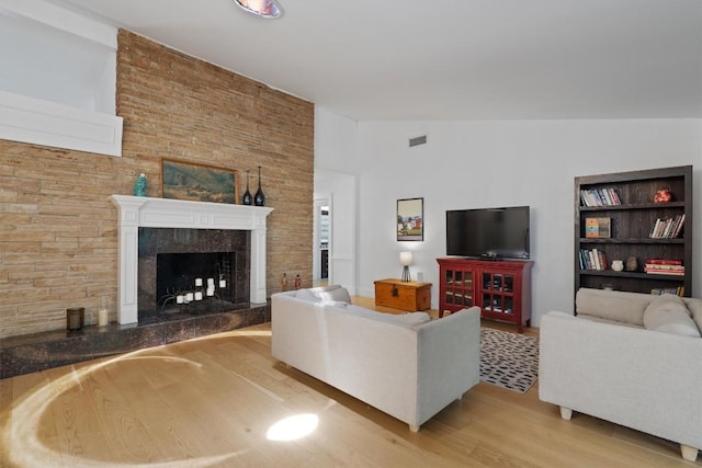 4604 Rue St, Austin, TX 78731 - living area with wood finished floors and a fireplace