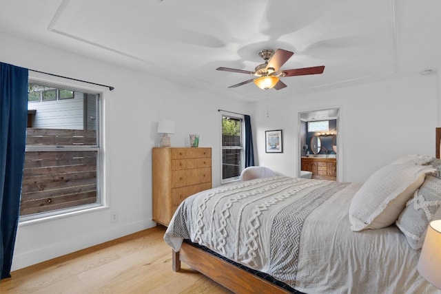 4604 Rue St, Austin, TX 78731 - bedroom with light wood finished floors and a ceiling fan