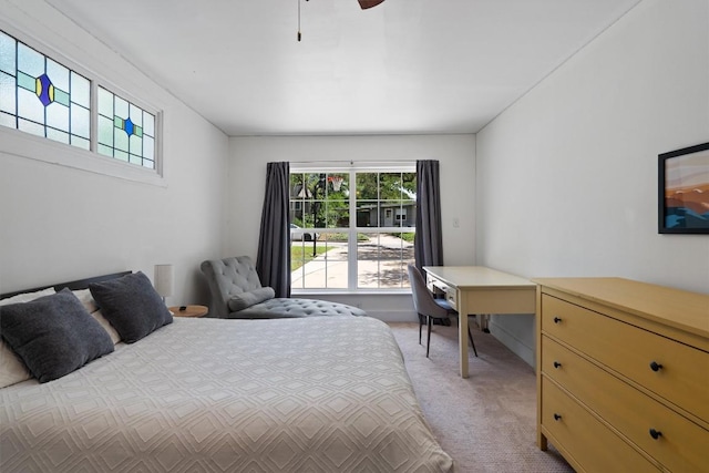 4604 Rue St, Austin, TX 78731 - bedroom with multiple windows, light colored carpet, and a ceiling fan