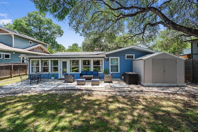 4604 Rue St, Austin, TX 78731 - back of house featuring a patio, a fenced backyard, outdoor lounge area, and a storage unit