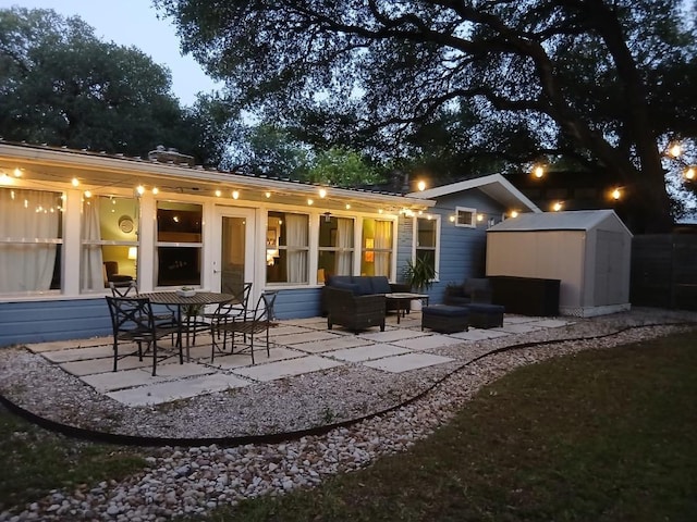 4604 Rue St, Austin, TX 78731 - back of property with a storage unit and a patio