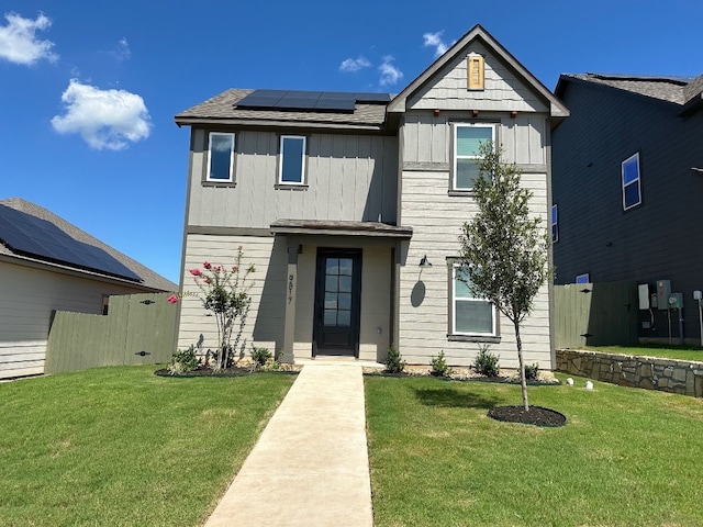 9517 Balmy Ln, Manor, TX 78653 - view of front of property featuring roof mounted solar panels and board and batten siding