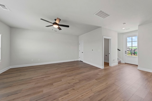 9517 Balmy Ln, Manor, TX 78653 - spare room with ceiling fan, wood finished floors, and stairway