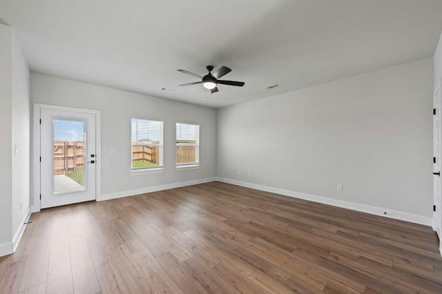 9517 Balmy Ln, Manor, TX 78653 - unfurnished room with ceiling fan and dark wood-style flooring