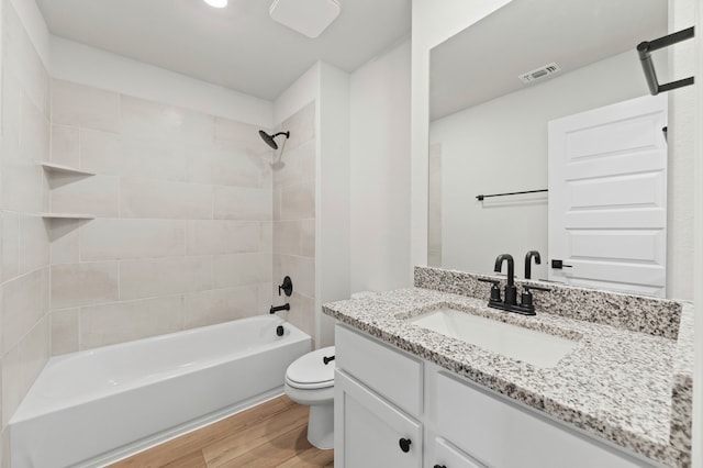 9517 Balmy Ln, Manor, TX 78653 - bathroom with wood finished floors, vanity, and  shower combination