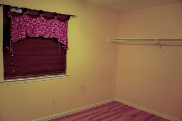 22631 John Rolfe Ln, Katy, TX 77449 - walk in closet featuring wood finished floors