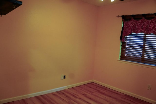 22631 John Rolfe Ln, Katy, TX 77449 - empty room with wood finished floors and baseboards