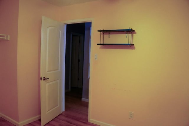22631 John Rolfe Ln, Katy, TX 77449 - unfurnished bedroom featuring baseboards and wood finished floors