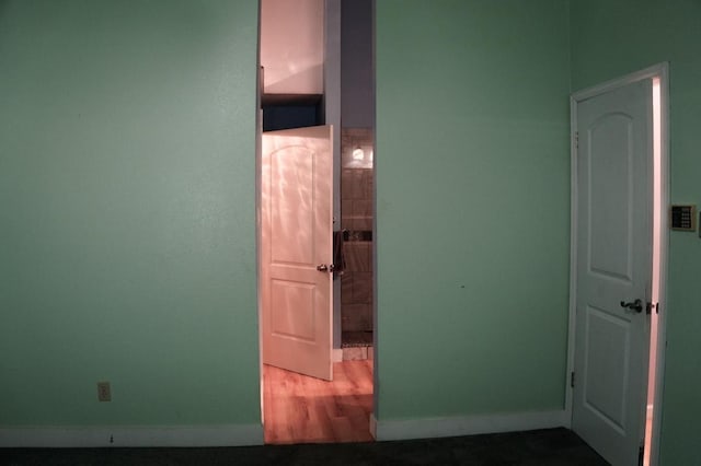 22631 John Rolfe Ln, Katy, TX 77449 - corridor with baseboards and wood finished floors