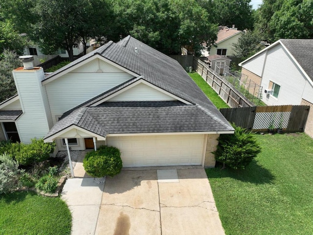 22631 John Rolfe Ln, Katy, TX 77449 - view of front of property featuring roof with shingles, driveway, a garage, and brick siding