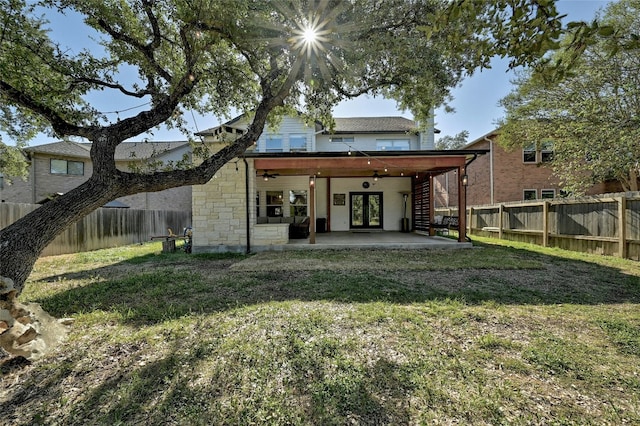 2011 Rachel Rdg, Cedar Park, TX 78613 - rear view of house with french doors, a fenced backyard, a patio area, and stone siding