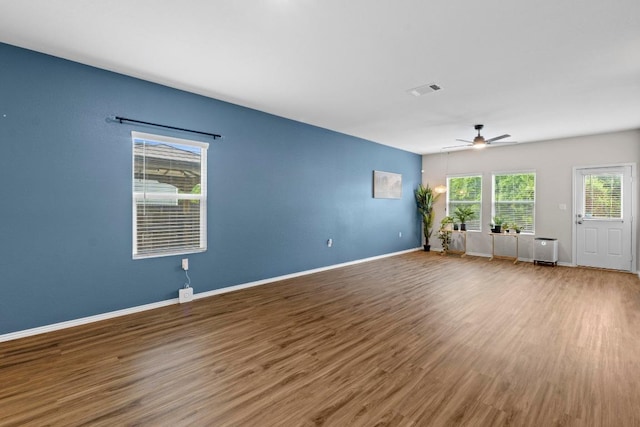 2416 Nightview Dr, Pflugerville, TX 78660 - unfurnished room with wood finished floors and a ceiling fan