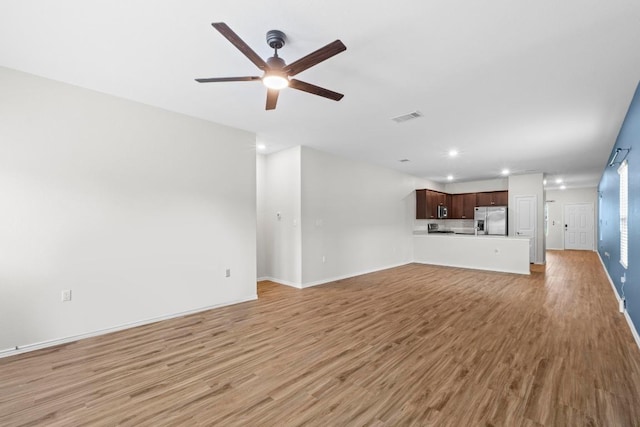 2416 Nightview Dr, Pflugerville, TX 78660 - unfurnished living room featuring recessed lighting, a ceiling fan, and light wood-style floors
