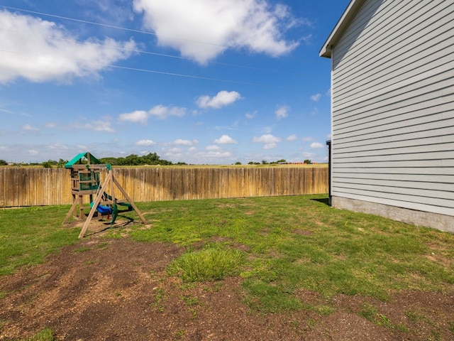 752 Circle Way Unit 35H, Jarrell, TX 76537 - fenced backyard featuring a playground