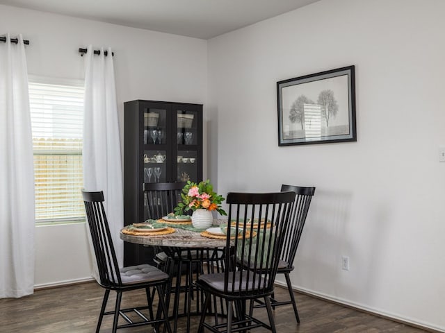 752 Circle Way Unit 35H, Jarrell, TX 76537 - dining area with dark wood-style flooring and baseboards