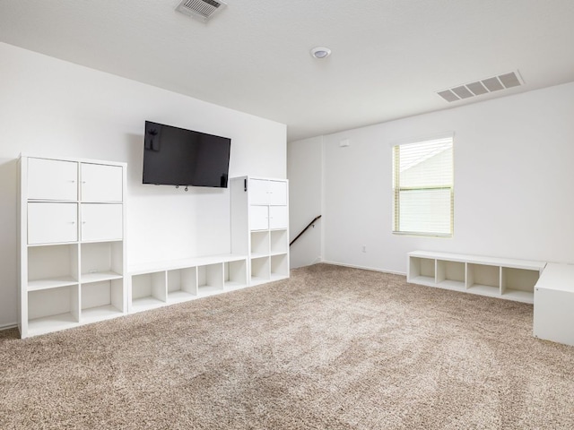 752 Circle Way Unit 35H, Jarrell, TX 76537 - unfurnished living room with carpet and baseboards